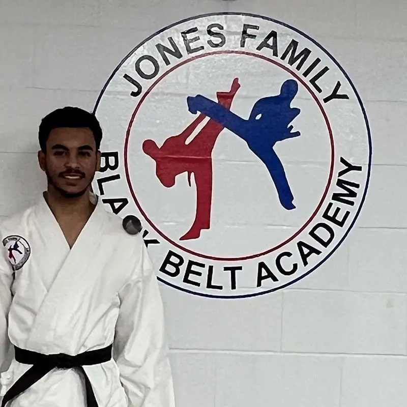 Adult MMA students practicing self-defense techniques in Evansville dojo
